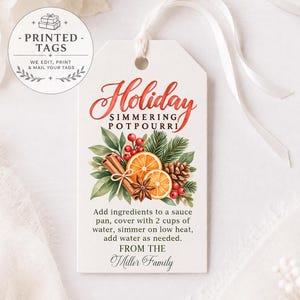 May include: A white rectangular gift tag with a white ribbon, featuring the text Holiday Simmering Potpourri, a watercolor illustration of orange slices, cinnamon sticks, pine, berries, and a pinecone, and instructions for use from the Miller Family.