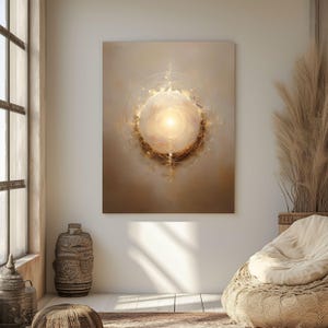 May include: Abstract art print featuring a glowing, spherical form at the center, radiating light and surrounded by soft, textured brushstrokes in warm beige and gold tones. The artwork evokes a sense of ethereal beauty and spiritual depth, suitable for home decor.