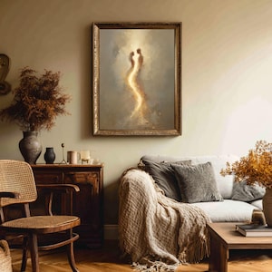 May include: A framed wall art print featuring two abstract human silhouettes facing each other, connected by a vertical stream of glowing golden light against a soft, muted gray and beige background, enclosed in an ornate, textured gold frame.