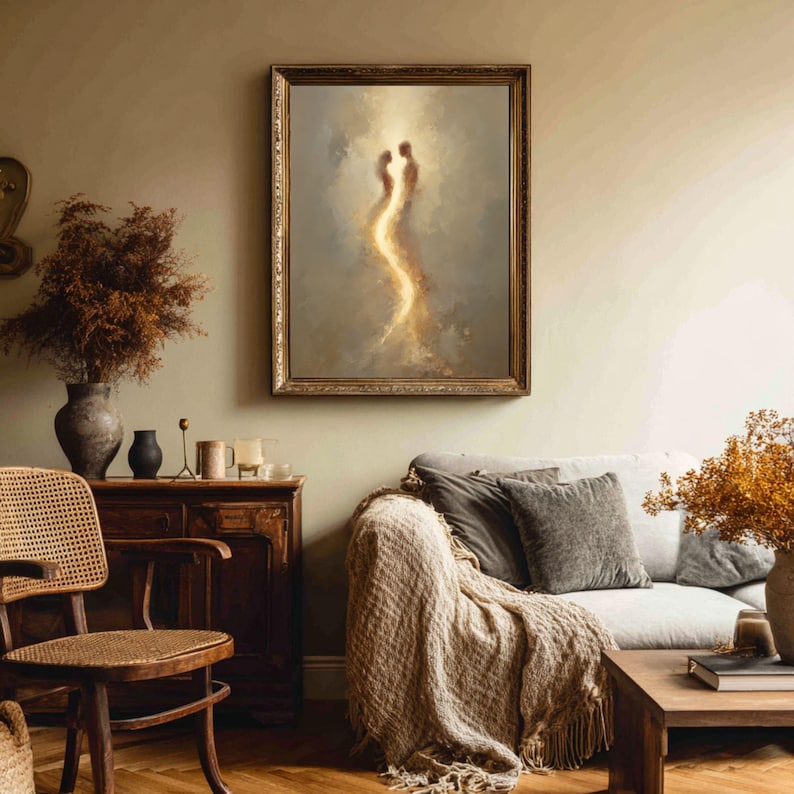 May include: A framed wall art print featuring two abstract human silhouettes facing each other, connected by a vertical stream of glowing golden light against a soft, muted gray and beige background, enclosed in an ornate, textured gold frame.