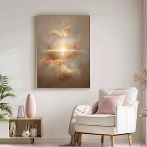 May include: Abstract art print featuring a celestial design with a bright, central light source. The artwork is framed in a gold-colored frame and depicts a cosmic scene with swirling clouds in shades of brown, gold, and pink. The print is displayed in a living room setting.