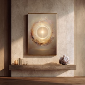 May include: Abstract art print in a gold frame. The artwork features a bright, central light source surrounded by swirling colors of gold, brown, and white. The painting hangs above a wooden shelf with books, candles, and a crystal.