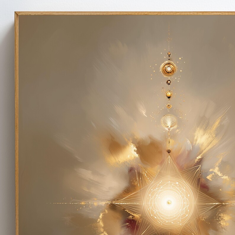 May include: Abstract art print in a wooden frame. The artwork features a celestial design with gold and beige tones. A central star-like shape radiates light, with a series of connected circular and linear elements. The background has a soft, blurred effect.