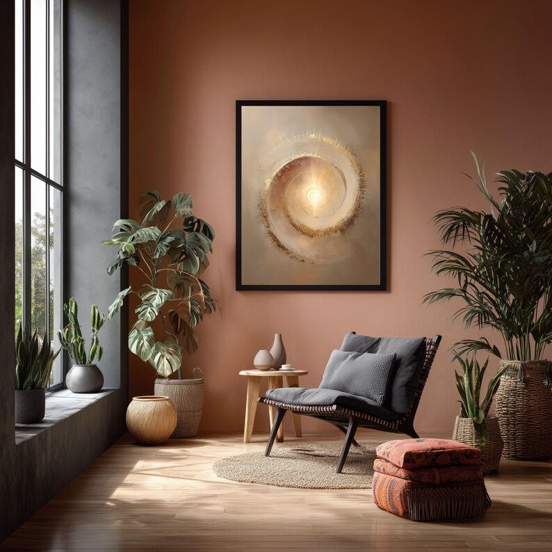 May include: A framed abstract art print with a spiral design in shades of beige and gold hangs on a salmon-colored wall. The room features a dark-framed chair with gray cushions, plants, and a wooden side table.