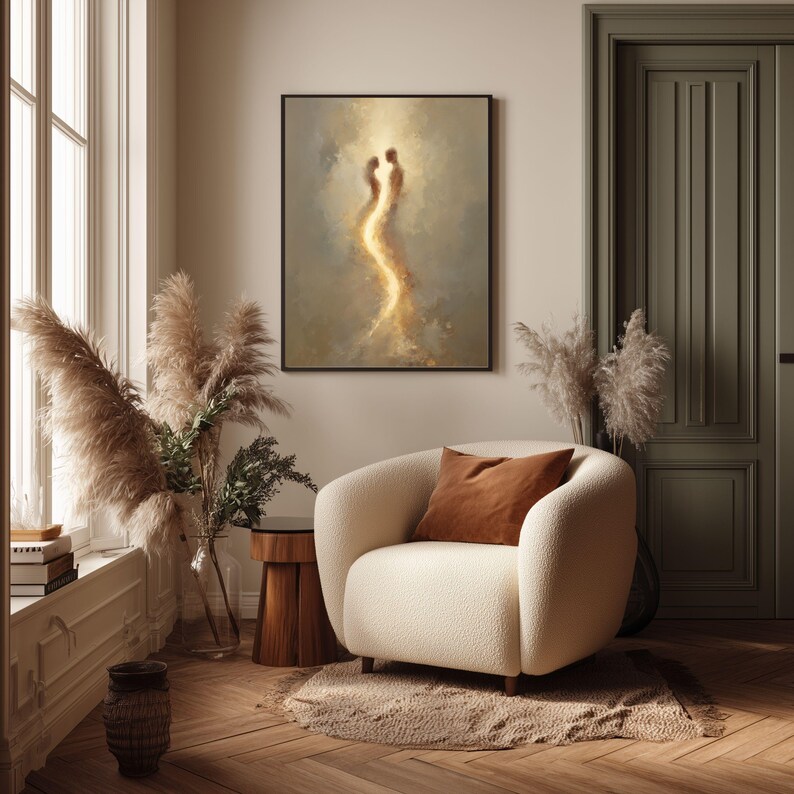 May include: A rectangular framed wall art piece featuring an abstract painting of two glowing, ethereal figures standing face-to-face, surrounded by soft, swirling golden and beige clouds, set against a muted, neutral-toned background.