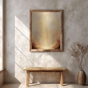 May include: A framed abstract painting with a warm color palette hangs on a textured wall. The painting features a blend of gold, brown, and red hues. Below, a wooden bench with a woven seat and a decorative vase with dried branches complete the scene.