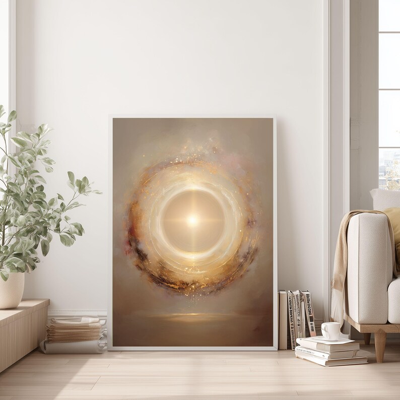 May include: Framed abstract art print featuring a central bright light surrounded by swirling golden and brown hues. The artwork evokes a sense of energy and cosmic beauty, with a soft, ethereal quality. The print is displayed in a white frame.