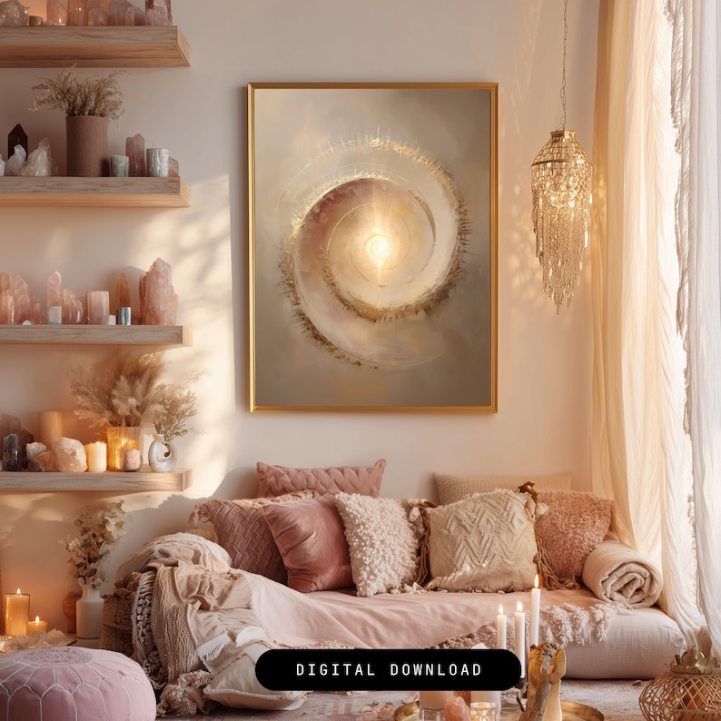 May include: A living room scene with a large framed abstract art piece in gold and neutral tones. The artwork features a spiral design with a bright center. The room includes a sofa with pink and cream pillows, candles, and decorative shelves with crystals.
