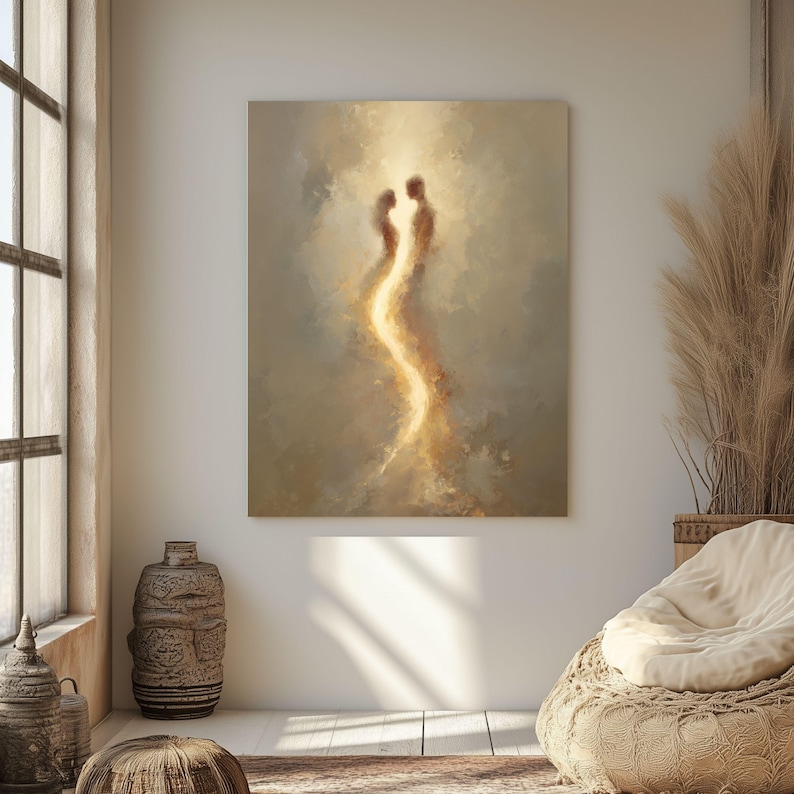 May include: A rectangular wall art print featuring an abstract painting of two ethereal figures facing each other, connected by a vertical stream of bright golden light against a soft, muted beige and cream-colored cloudy background.
