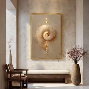 May include: A framed art print featuring a detailed, golden-hued nautilus shell design. The artwork is set against a neutral background and framed in gold. The image is displayed in a room with a bench, chair, and vase.