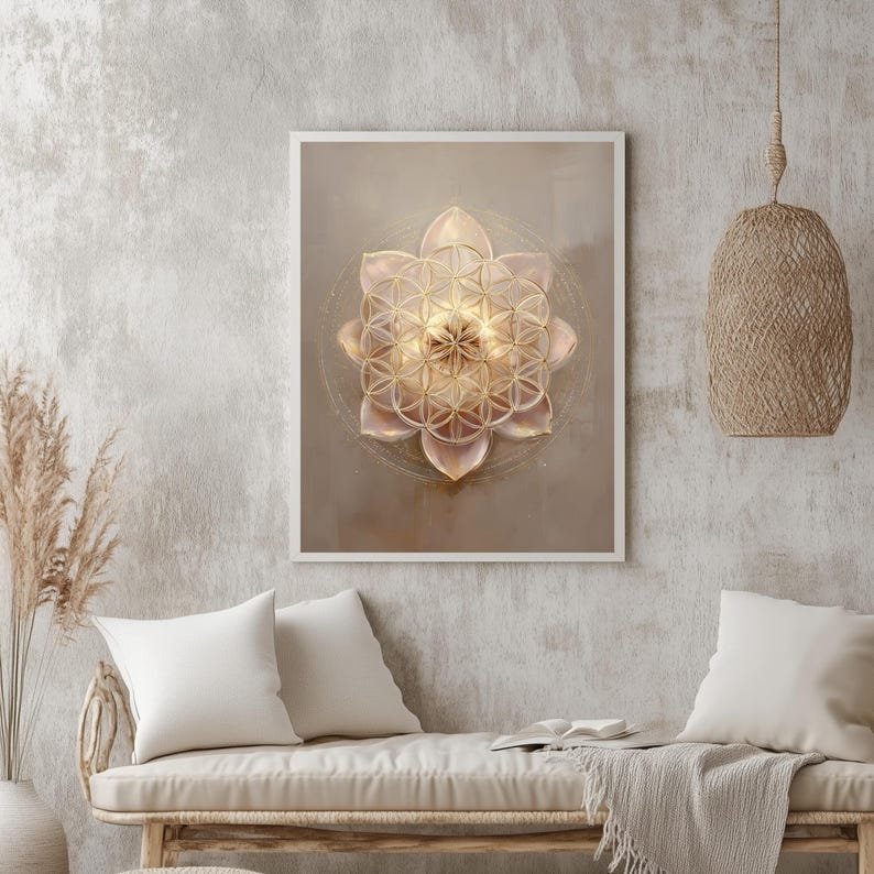 May include: A framed artwork with a golden flower design and geometric patterns. The artwork is set against a neutral background. The piece is displayed in a room with neutral decor, including pillows and a woven light fixture. The artwork is a decorative piece.
