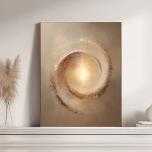May include: Abstract art print featuring a spiral design with a bright, central light source. The artwork uses warm tones of gold, beige, and brown, creating a sense of depth and movement. The framed piece is displayed on a white surface.