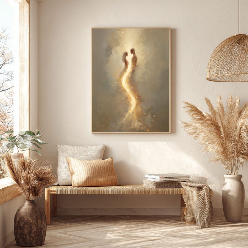 May include: A rectangular wall art print featuring an abstract, ethereal depiction of two figures facing each other, connected by a glowing, golden light against a soft, muted beige and brown background, framed in a light-colored wooden frame.