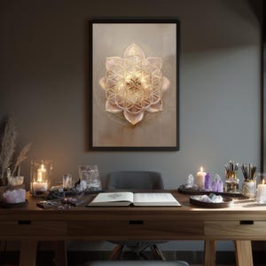 May include: A framed print with a gold geometric flower design. The print hangs above a wooden desk with candles, crystals, and an open book. The scene is illuminated by warm light, creating a calm and peaceful atmosphere.