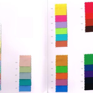 May include: A color chart with fabric swatches in various colors, including yellow, green, blue, red, orange, and brown. The swatches are arranged in columns and labeled with numbers.