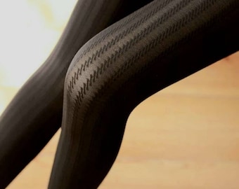 May include: Black patterned tights with a houndstooth design.