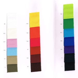 May include: A color chart with fabric swatches in various colors, including white, yellow, orange, red, brown, green, blue, and black. The swatches are labeled with numbers.