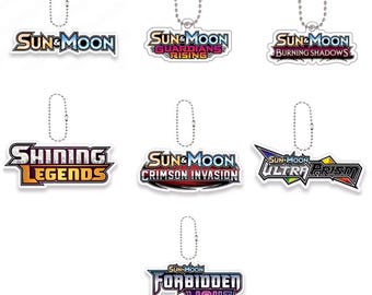 Pokémon Keychain | TCG Set Logo (Sun & Moon, Guardians Rising, Shining Legends, Ultra Prism, Forbidden Light) – Binder Collector Accessory