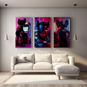 May include: Three framed art prints featuring a black figure with X-ed out eyes in different poses. One plays an arcade game, another DJs, and the third stands in an apron. The prints hang above a white sofa in a modern living room.