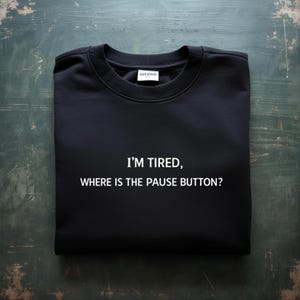 May include: A set of three ceramic mugs with a speckled, matte finish. The mugs are in shades of cream, light gray, and dark gray. Each mug has a simple, minimalist design and a rounded handle.