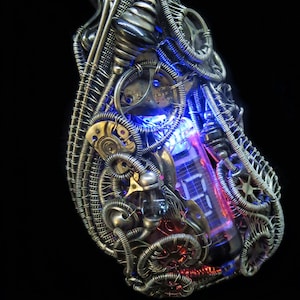 May include: A silver wire-wrapped pendant with a digital display, gears, and blue and red LED lights. The pendant is attached to a black cord.