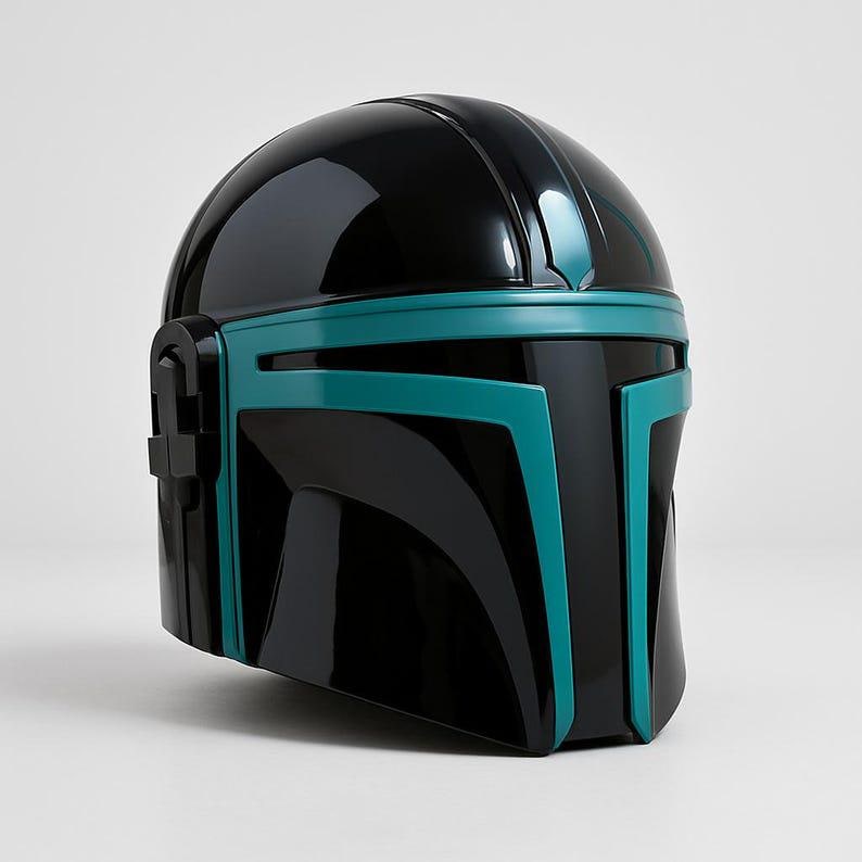 May include: A glossy black helmet featuring a smooth, rounded dome and a distinct T-shaped visor area accented with vibrant teal trim. The design includes a prominent central ridge and side ear-cap details, showcasing a sleek, reflective finish.