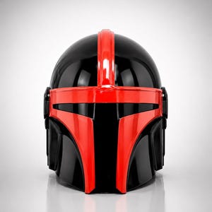 May include: A glossy helmet featuring a black base color with a prominent red T-shaped visor frame and a vertical red stripe running over the center of the dome. The design includes black side panels and a smooth, reflective finish throughout the piece.
