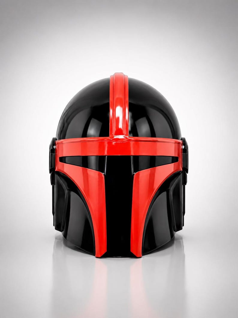 May include: A glossy helmet featuring a black base color with a prominent red T-shaped visor frame and a vertical red stripe running over the center of the dome. The design includes black side panels and a smooth, reflective finish throughout the piece.