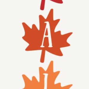 May include: A vertical design with the word "hello" in black script above four colorful maple leaves. The leaves are red, orange, and yellow, spelling "FALL" in white block letters.