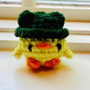 Crochet Duck Wearing A Frog Hat Plushie Amigurumi