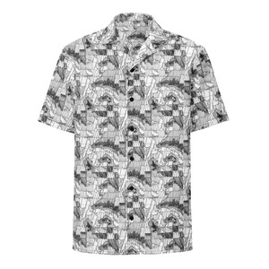 May include: Short-sleeved button-down shirt with a black and white abstract pattern. The shirt features a classic collar and black buttons. The design is a repeating pattern of geometric shapes and lines, creating a textured appearance. The shirt is made of a lightweight fabric.