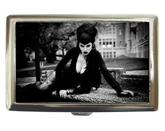 Elvira portrayed by Renee Rockwood cigarette case