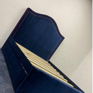 Upholstered Bed w/ Curved Headboard & Rolling Trundle