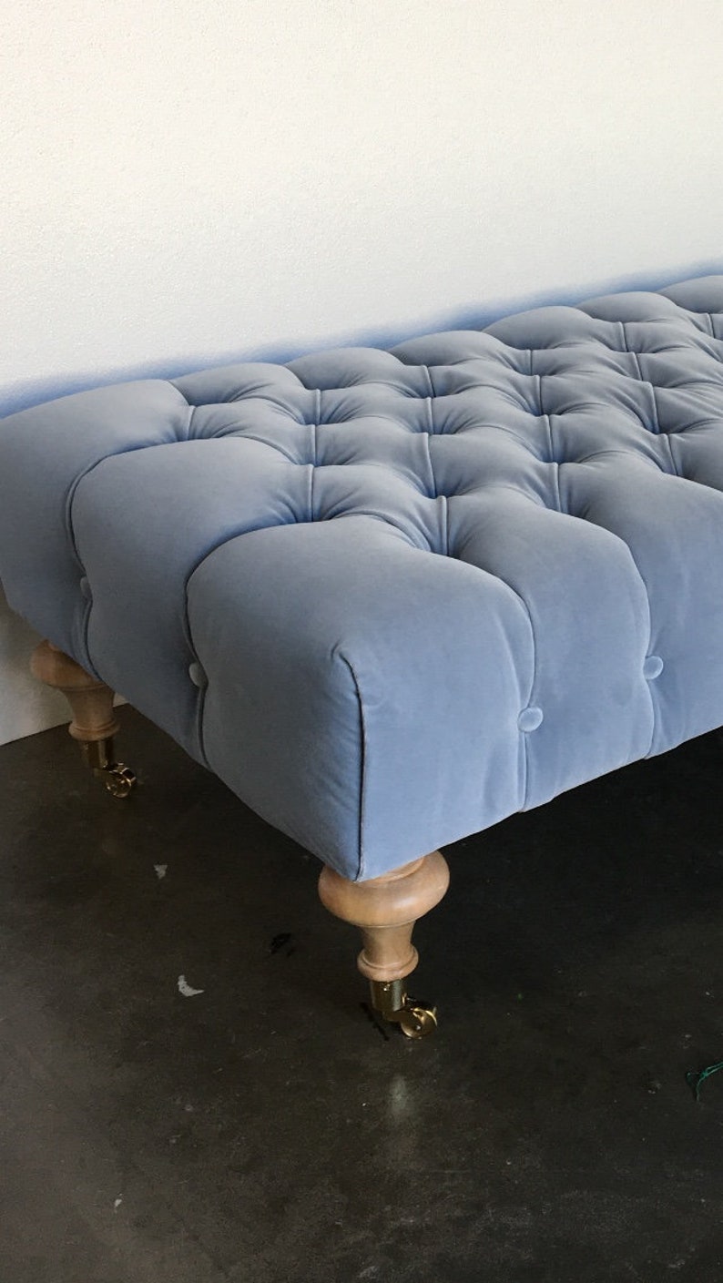 Tufted Ottoman W/ Turned Wood Feet on Casters COM image 4