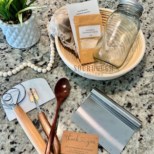 Sourdough starter kit with banneton basket, whisk and live starter