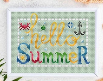 May include: Cross-stitch art in a white frame with the words "hello SUMMER" in yellow and colorful letters. The design includes a crab, anchor, and other summer-themed elements. The background is light green.