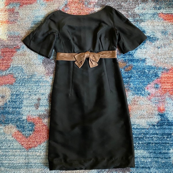 Vintage 1950s MISS WINSTON black satin empire waist formal sheath dress w/ a bronze bow belt and bell sleeves, size XS