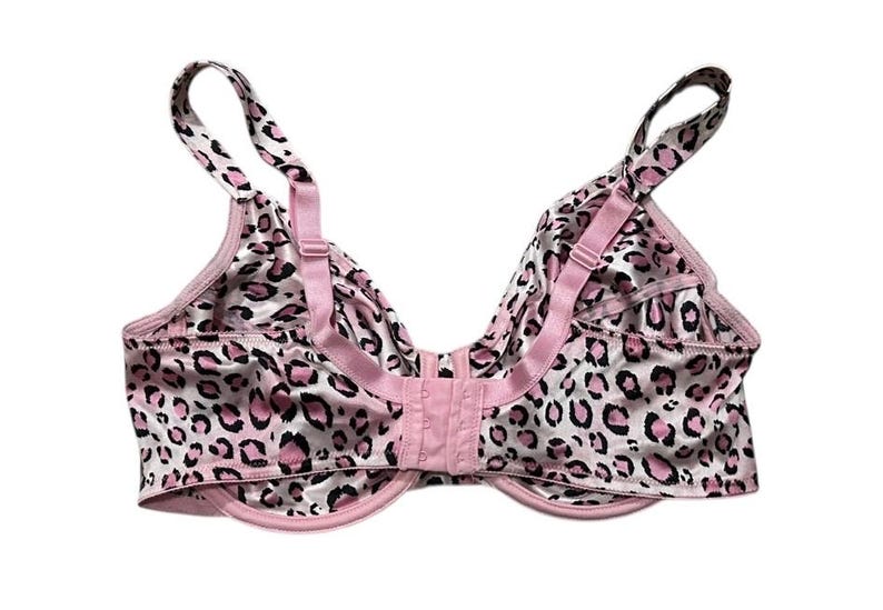 May include: A pink and white leopard print bra with adjustable straps and a hook-and-eye closure. The bra features a classic design with a satin-like finish, offering a touch of elegance and comfort.