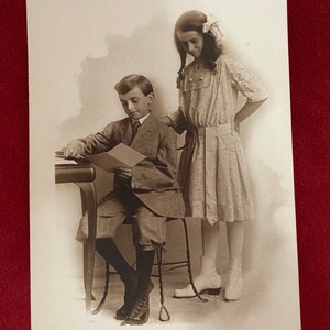 Antique early 1900s black & white boy and girl / brother and sister siblings family photo / photograph