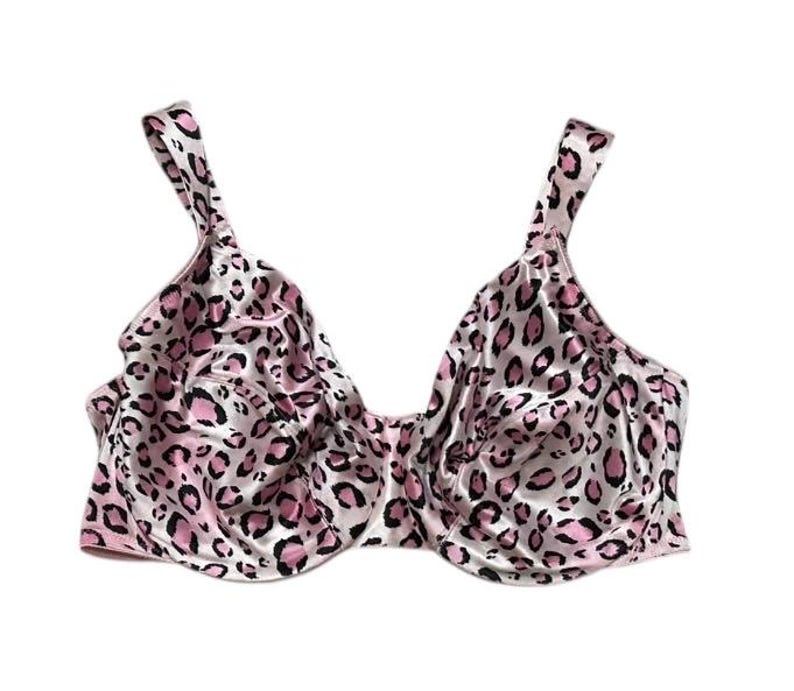 May include: A pink and black leopard print bra with adjustable straps. The bra features a full coverage design with underwire support. The fabric has a satin sheen.