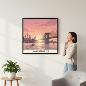 May include: Framed art print of the Brooklyn Bridge at sunset. The illustration features the bridge, city skyline, and a boat on the water, with text that reads "BROOKLYN BRIDGE - NYC". The artwork is in a black frame.