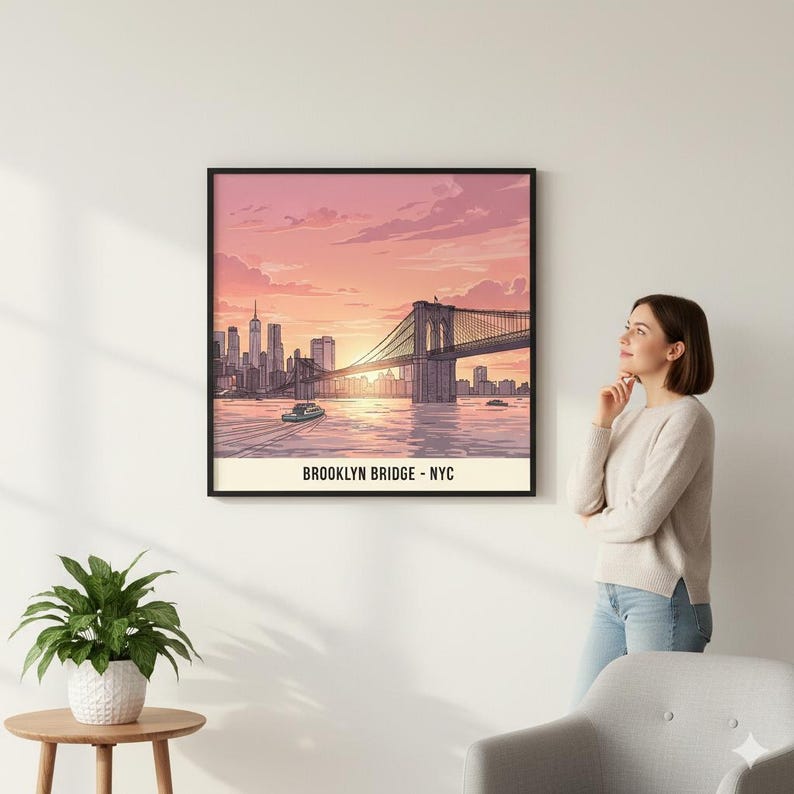 May include: Framed art print of the Brooklyn Bridge at sunset. The illustration features the bridge, city skyline, and a boat on the water, with text that reads "BROOKLYN BRIDGE - NYC". The artwork is in a black frame.