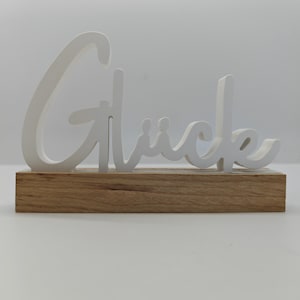 Handmade “lucky” decoration made of Raysin with wooden base – customizable in your desired color
