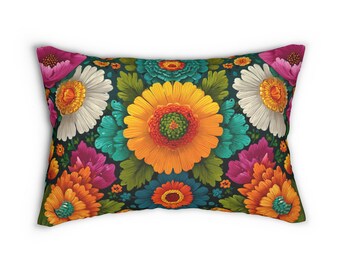 May include: Rectangular decorative pillow with a vibrant floral pattern. The design features large, stylized flowers in shades of orange, yellow, white, teal, and pink against a dark background. The pillow is a home decor item.