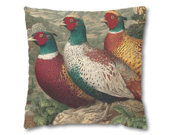 May include: Square throw pillow featuring a vintage illustration of three pheasants. The birds have red faces, green necks, and brown and white patterned bodies. The background depicts a landscape with mountains and foliage.