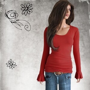 May include: A long-sleeved red top with a scoop neckline and flared bell cuffs, paired with blue denim jeans featuring front pockets and a brown belt with a silver buckle. The background is a light gray texture with black line art of flowers.