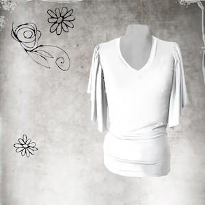 May include: A white V-neck top with short, flared sleeves. The top is displayed on a mannequin against a textured, gray background with simple floral line drawings.