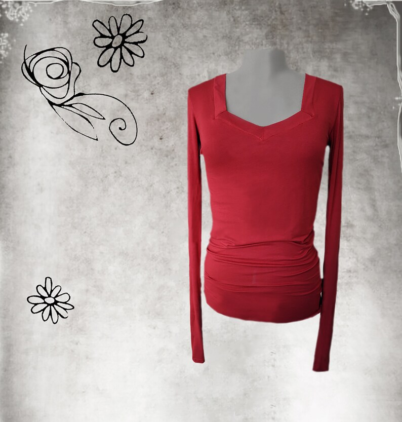 May include: A long-sleeved, red, fitted shirt with a V-neckline.