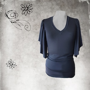 May include: A dark blue, short-sleeved top with a V-neck and a gathered waist. The sleeves have a wide, flowing shape.