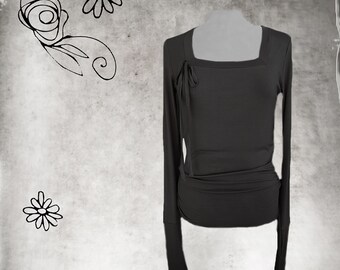 May include: A long-sleeved, dark gray, square-neck top with a tie detail at the neckline.